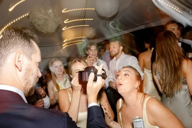 Wedding guests recording with a Wedding Weekender camcorder